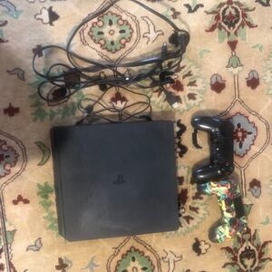 Sony Gaming Console with Black and Multicolor Controller